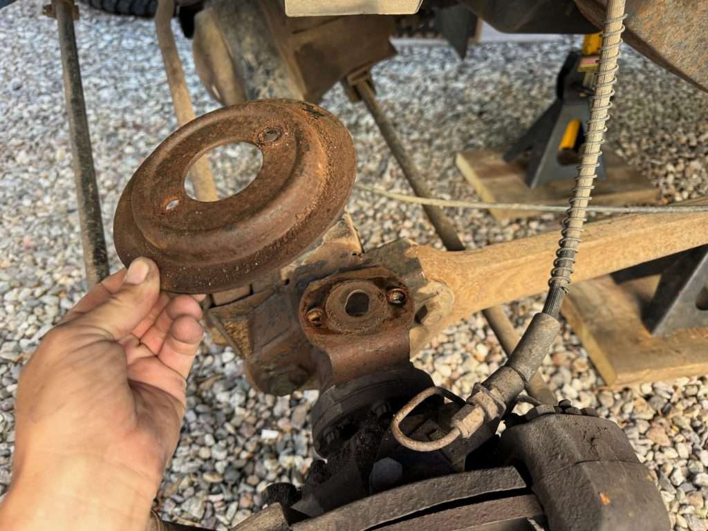 Although not in dire need of being replaced, the lower spring seat is easily removed to replace with a shiny new one.