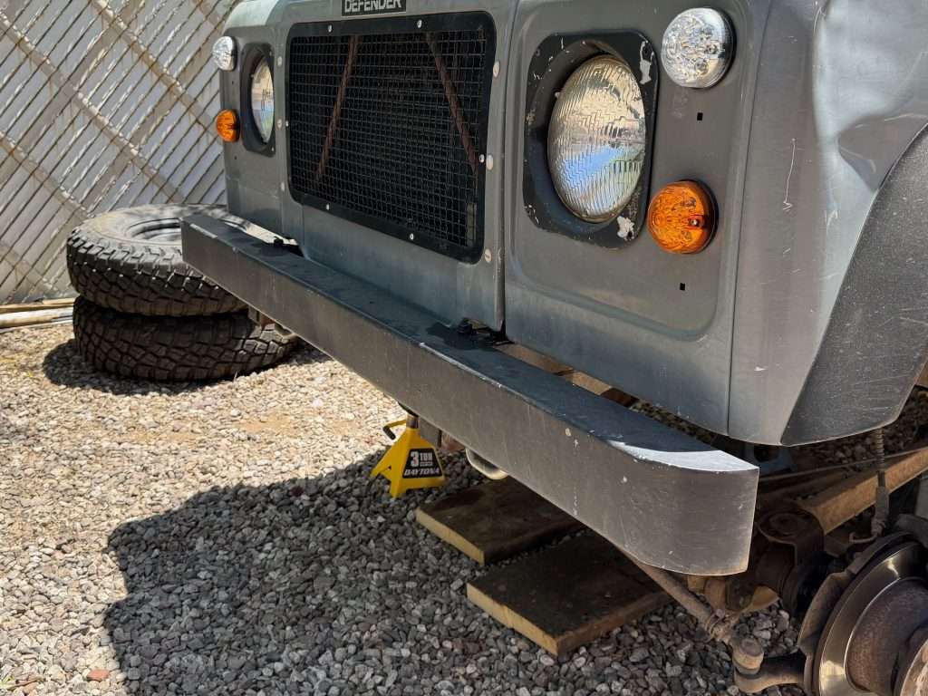 While I love the classic simplicity of the stock Land Rover Defender bumper, we need a winch tray!