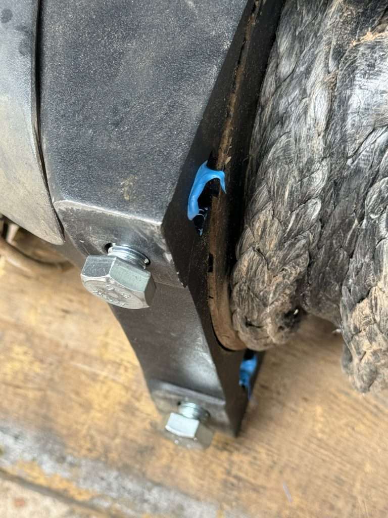 Thread the bolts into the winch seat for a few minutes until the permatex sets with the nuts in position