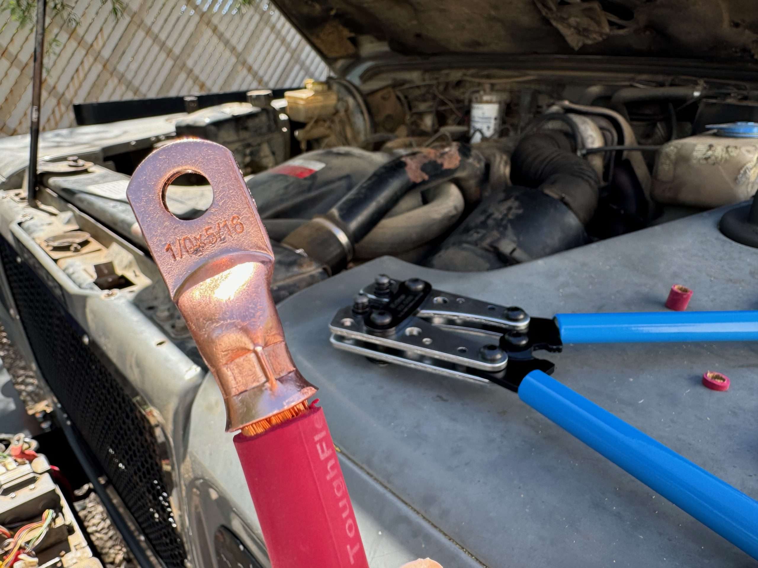 The inexpensive crimper from Amazon did a good job. This ring terminal isn't going anywhere.