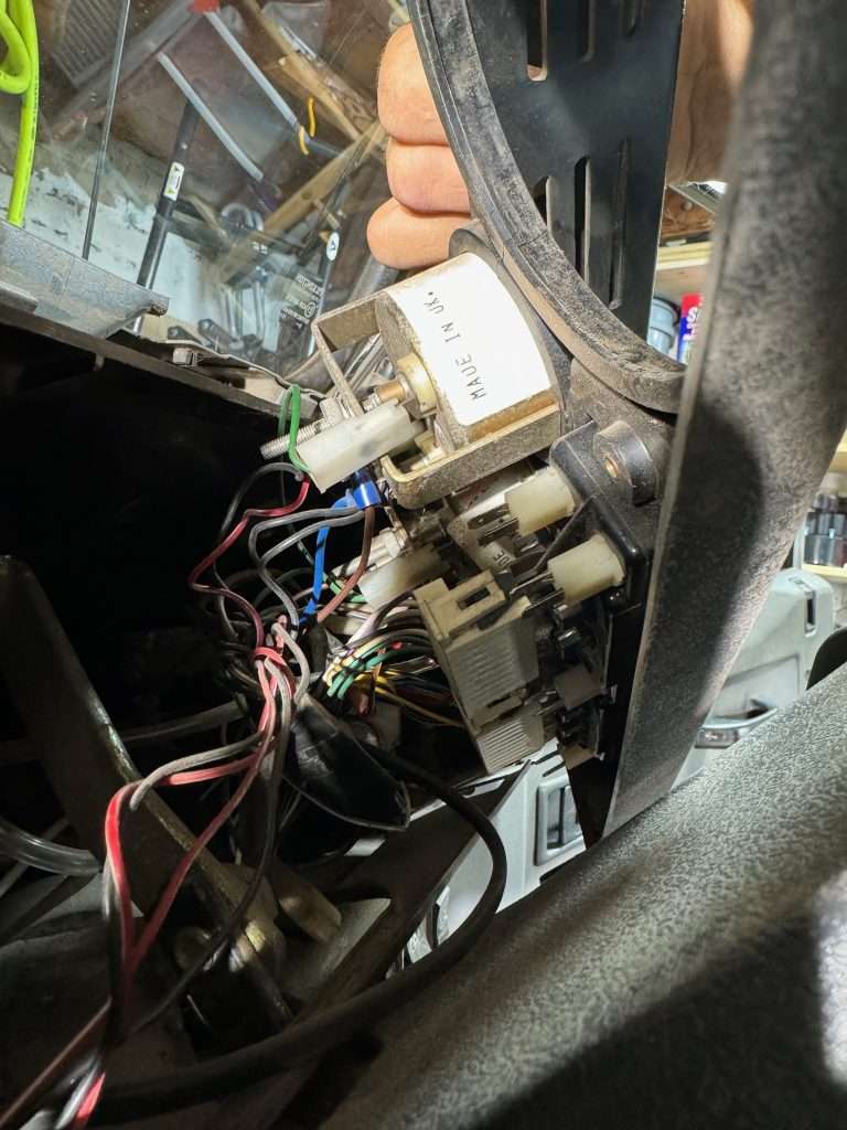 Phone photos taken of the back of the gauge cluster for reference.