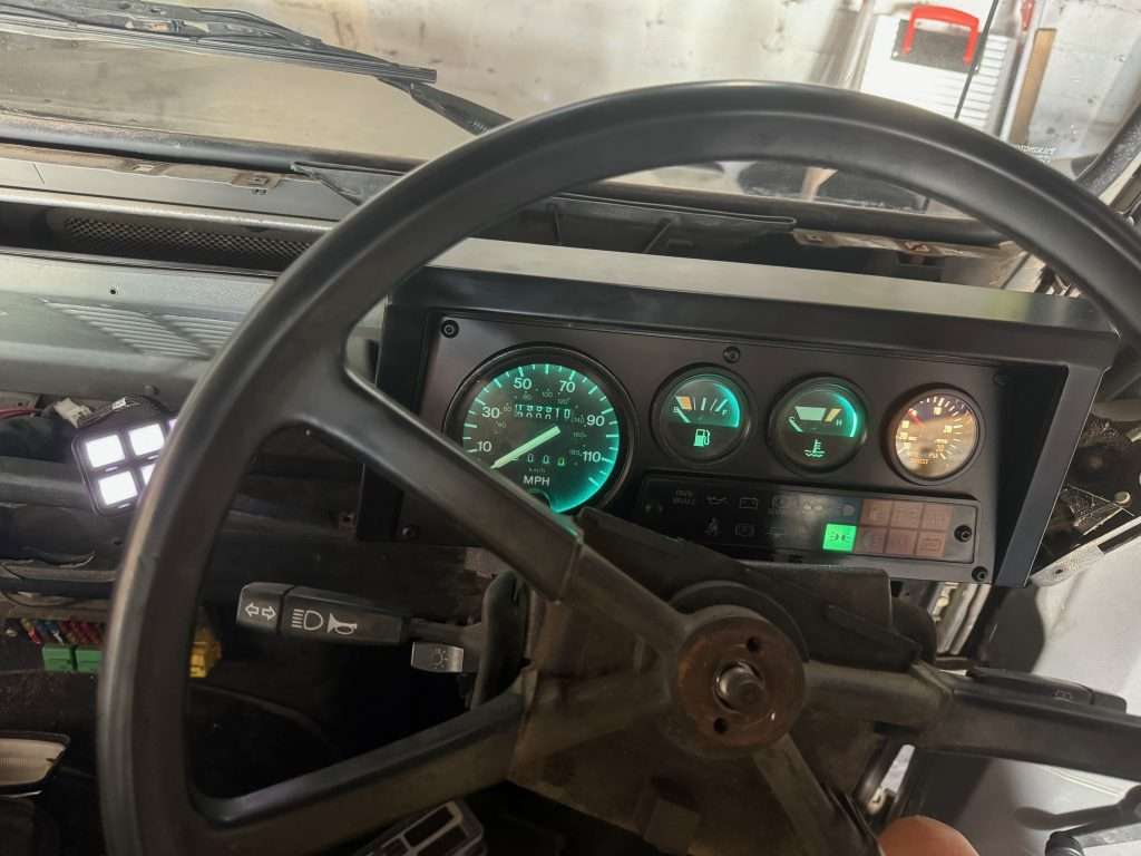 The Land Rover Defender gauges have green filters, so you will likely want to get white bulbs unless you're aiming for a different appearance.