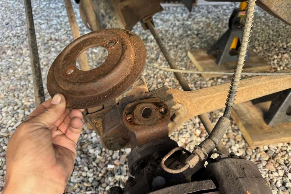 Although not in dire need of being replaced, the lower spring seat is easily removed to replace with a shiny new one.