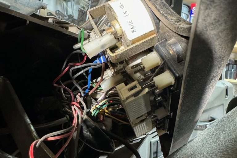 Phone photos taken of the back of the gauge cluster for reference.