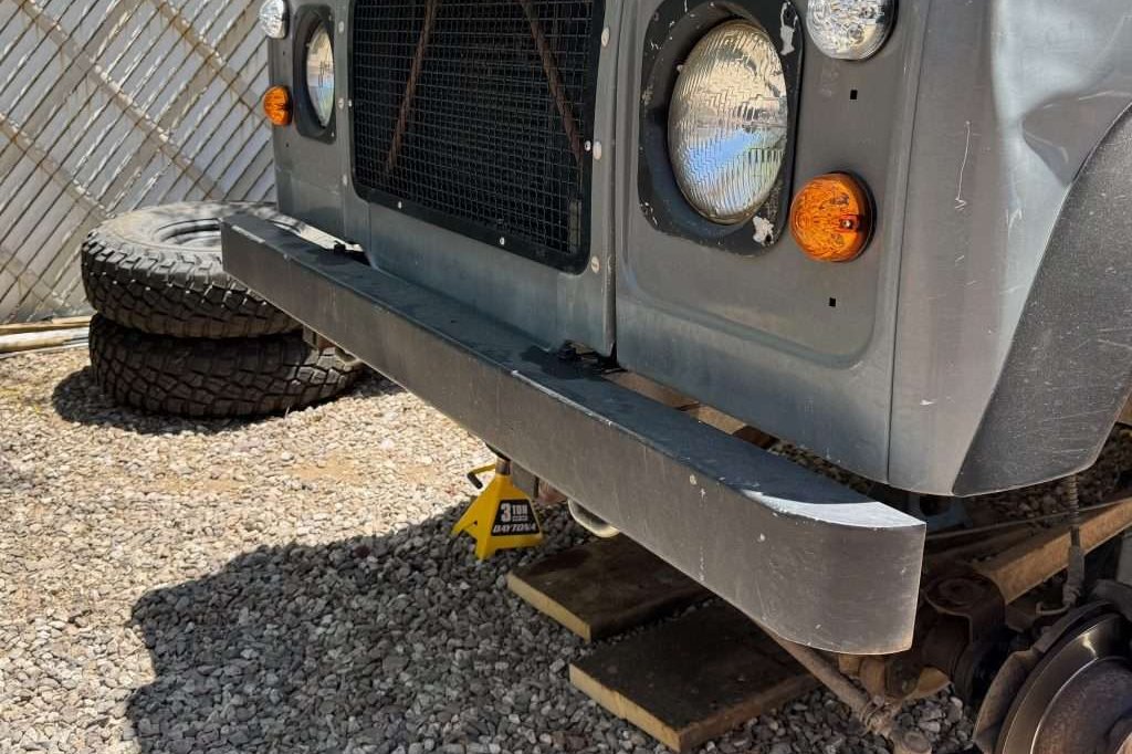 While I love the classic simplicity of the stock Land Rover Defender bumper, we need a winch tray!