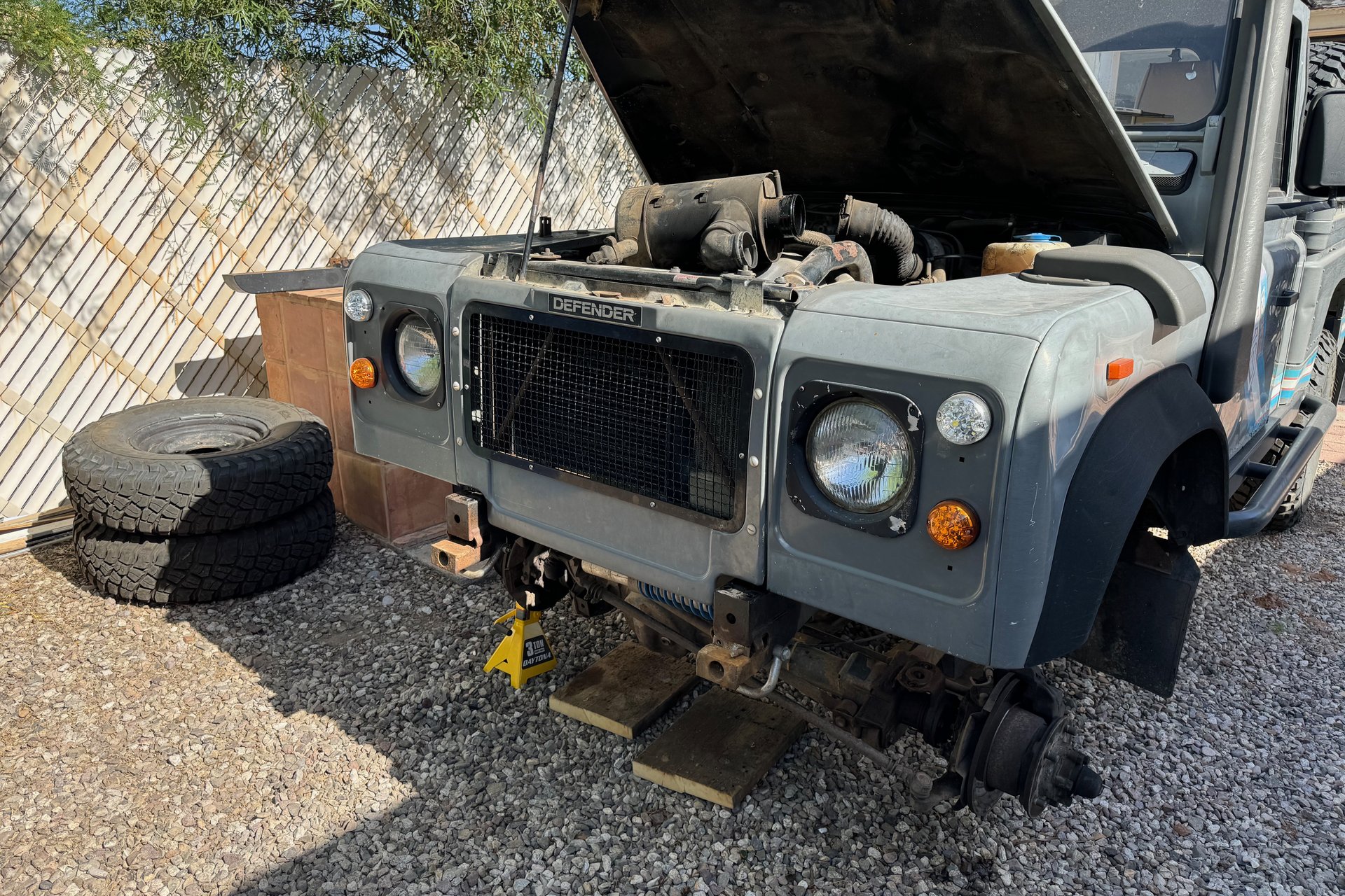 The old front bumper has to be removed from the Land Rover to make way for a new winch bumper